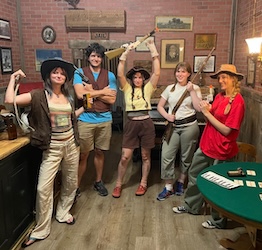 A portrait of the lab members in a western-themed escape room
