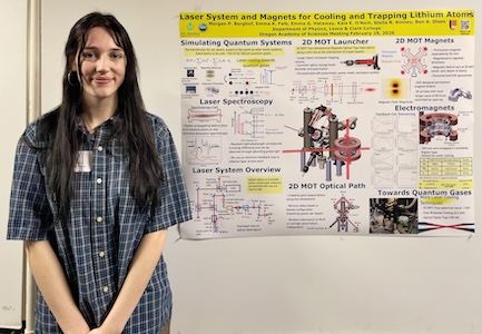 Morgan in front of her poster at the OAS conference