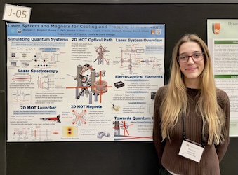 Morgan in front of her poster at the MCSR conference