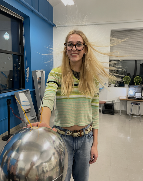 Morgan with her hair standing up due to a van de Graaff generator